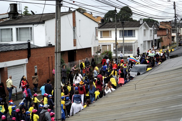Schoolkids marching in the hotel street. Schoolkids marching in the hotel street.