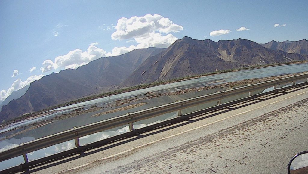 Mountains and water look nice on a sunny day.
