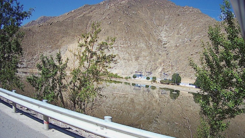 Reflecting lake by the road.
