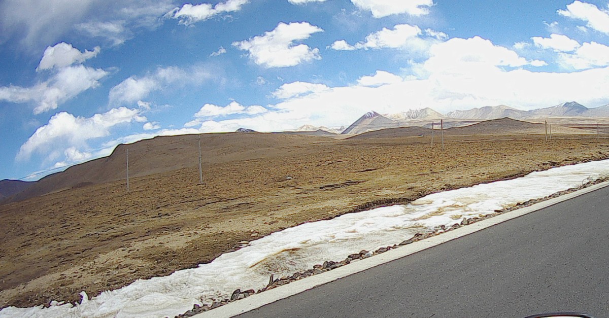Snow by the roadside.