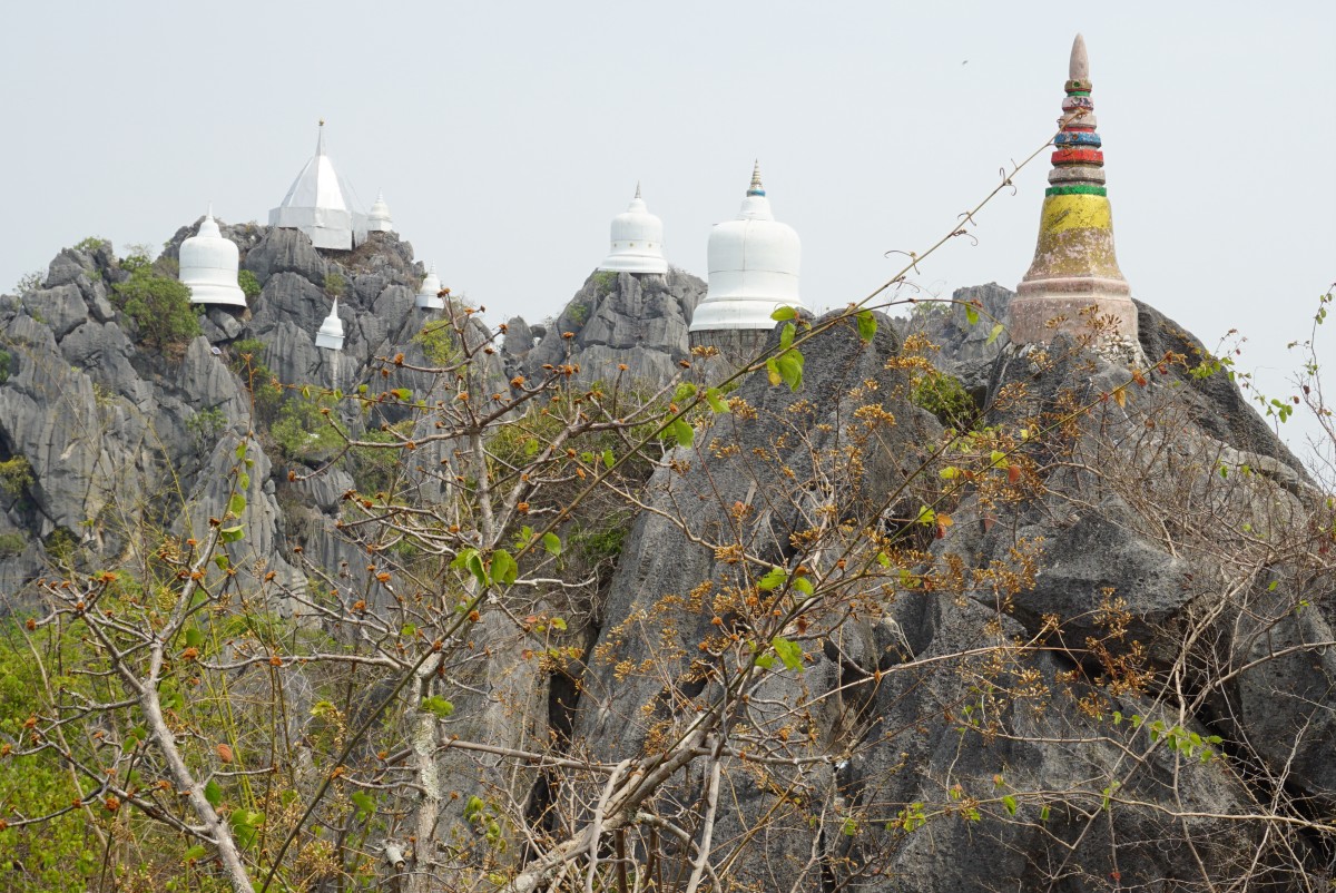 Built on top of the hill with towers scattered on the hill.