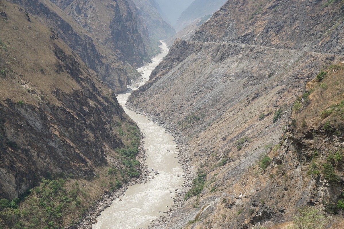 The Yangtze river in all it's might flows at the bottom of the gorge.