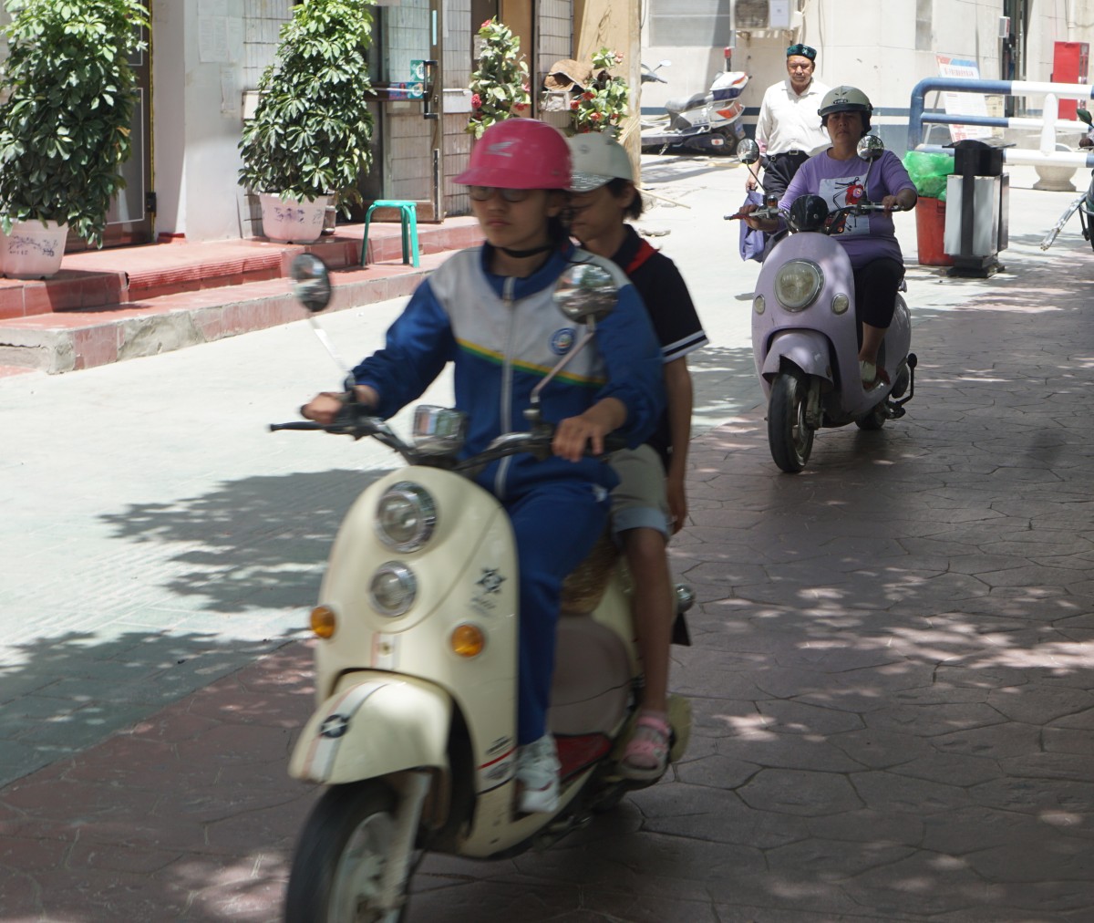 Lots and lots of electric mopeds going at pretty high speed in their designated lanes.