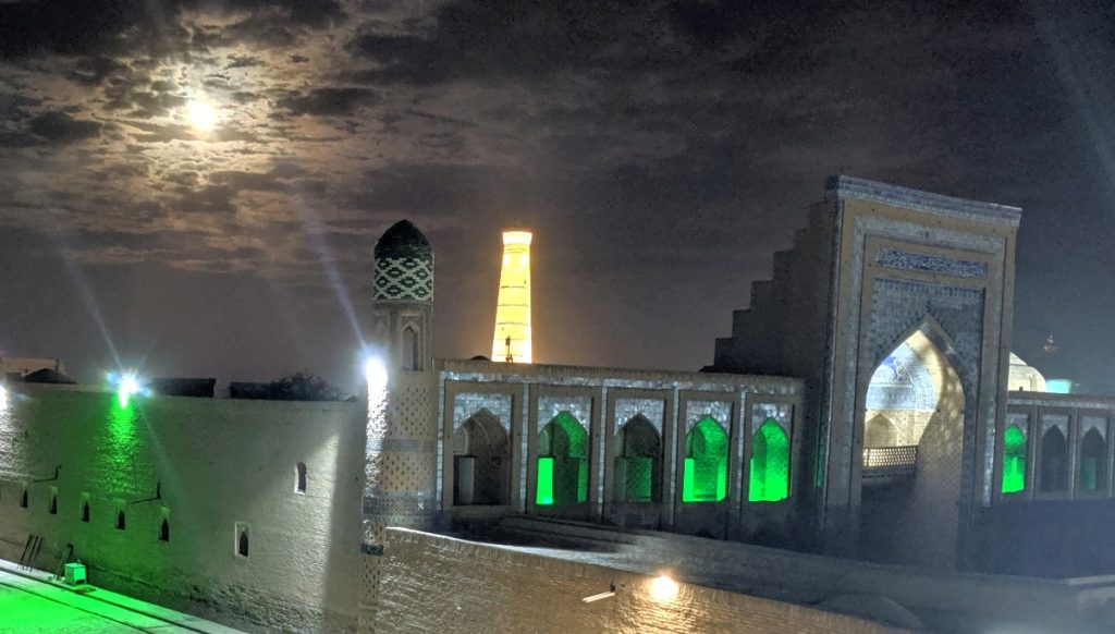 Khiva minaret along full moon.